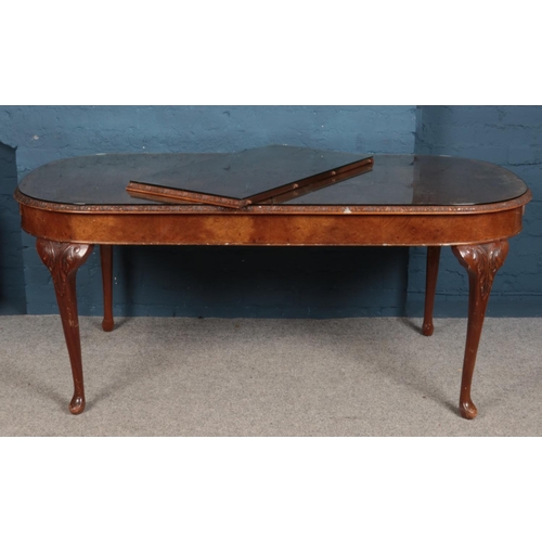 536 - A walnut extending dining table, with additional leaf, together with five dining chairs, one carver ... 