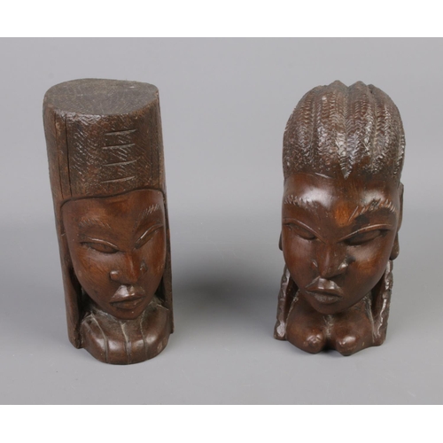 140 - A pair of wooden carved tribal heads.