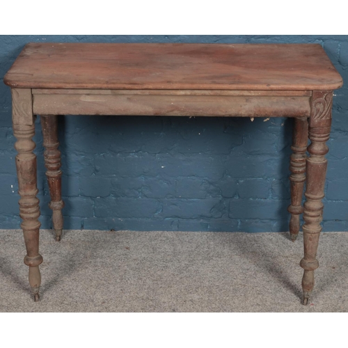 511 - A Regency carved mahogany side table. Formally a fold over tea table (74cm x 101cm)