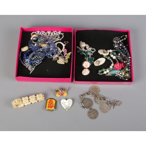 146 - Two trays of costume jewellery including necklaces, bracelets and brooches.