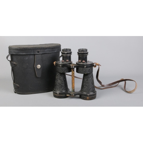 70 - A pair of Bino Prism MK IV military binoculars, bearing broad arrow mark to shoulder, with case.