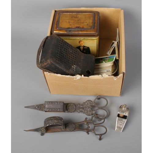 71 - A box of assorted including a quantity of cigarette cards and pewter candlestick snuffers.