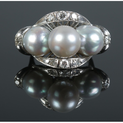 384 - A vintage white metal cultured pearl and diamond cocktail ring. Size M½. Total weight: 7.68g