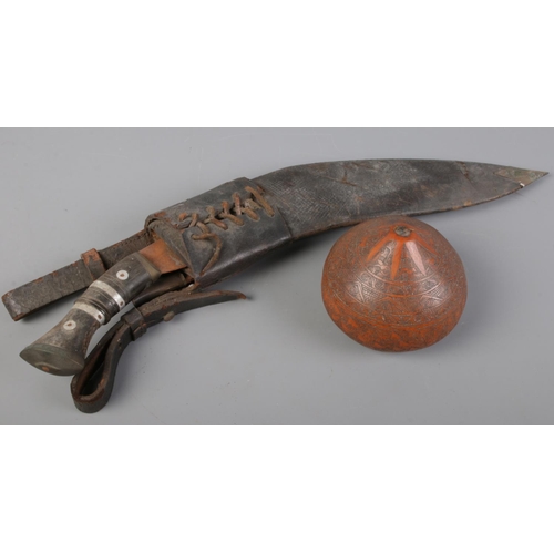 76 - A carved gourd along with a kukri knife with sheath.