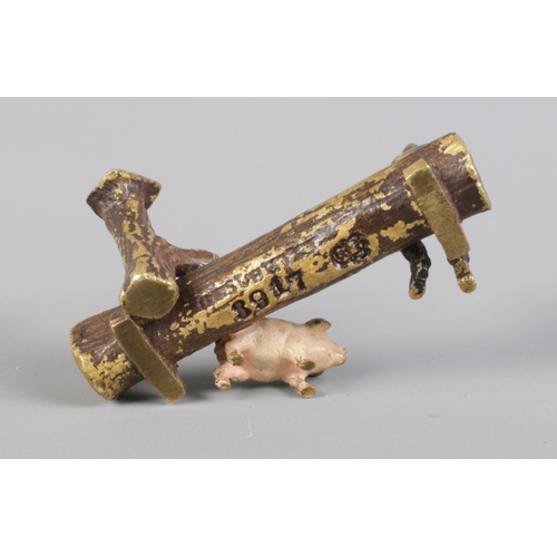 411 - An Austrian cold painted bronze miniature of a trough, pump, farmer and pig. Stamped '3917', bearing... 