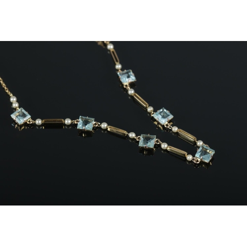 422 - An early twentieth century 9ct Gold necklet, set with pale blue stones. Total weight: 4.79g.