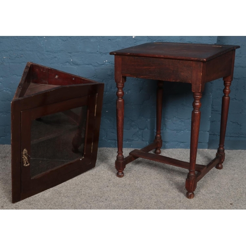 488 - A vintage oak writing desk along with a wall mounted corner cupboard.