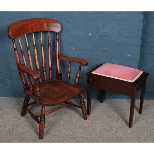 489 - An oak spindle back arm chair with turned support along with a mahogany upholstered piano stool.