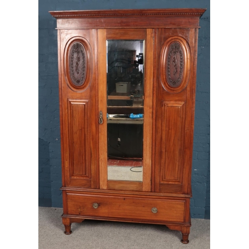 491 - An Edwardian mahogany mirror front wardrobe. (206cm x 129cm)