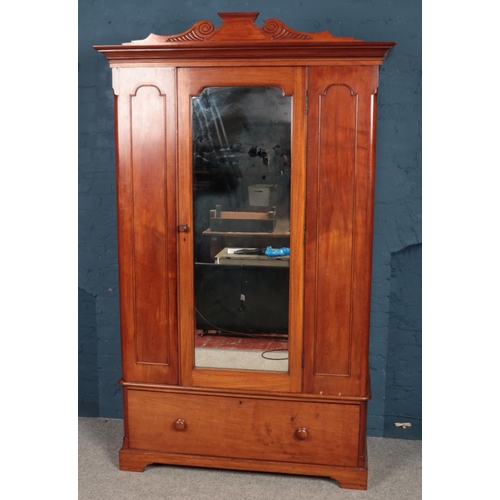 492 - A Victorian mahogany mirror front wardrobe. (223cm x 136cm)