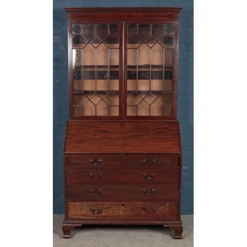 495 - A mahogany and astragal glazed bureau bookcase, featuring fitted interior with shell motif. Height: ... 