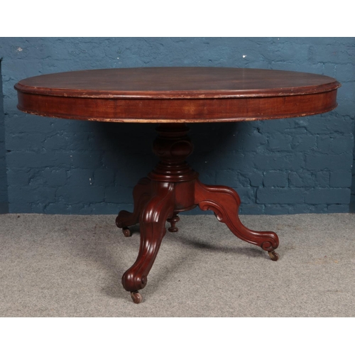 498 - A mahogany circular tilt-top table, with central pillar supported by three cabriole feet, raised on ... 