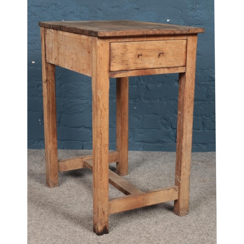 499 - A small pine work table with lower drawer. Height: 79cm, Width: 46cm, Depth: 61cm.