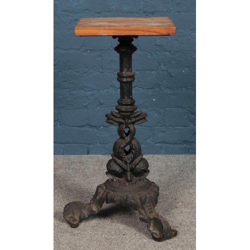 500 - A painted cast iron and and wood top plant stand. 69cm high.