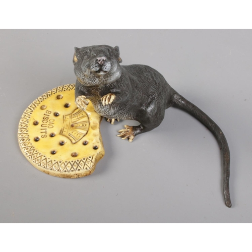 40 - A cold painted bronze model of a rat with a Cao Biscuit. Bearing Franz Bergman stamp.