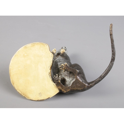 40 - A cold painted bronze model of a rat with a Cao Biscuit. Bearing Franz Bergman stamp.