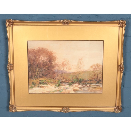 164 - George Graham (1881-1949) - A gilt framed watercolour depicting a countryside view, fronted with tre... 