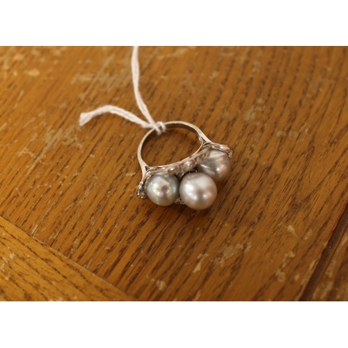 384 - A vintage white metal cultured pearl and diamond cocktail ring. Size M½. Total weight: 7.68g