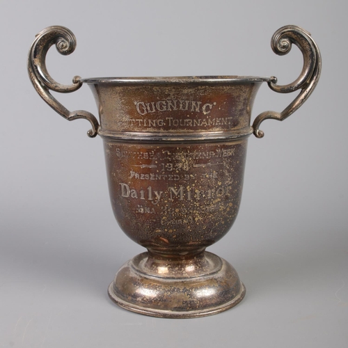 101 - A silver twin handled cup presented for the Gugnunc Putting Tournament by The Daily Mirror. Part of ... 