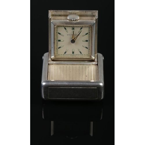 117 - A vintage silver travelling timepiece by Dunhill. With engine turned decoration to case. Stamped 925... 