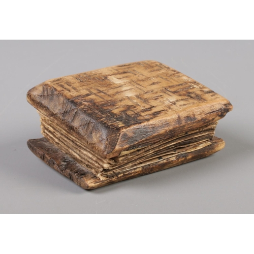 122 - A small Indonesian Pustaha/magic book. Written in Batak with illustrations on bark in concertina for... 