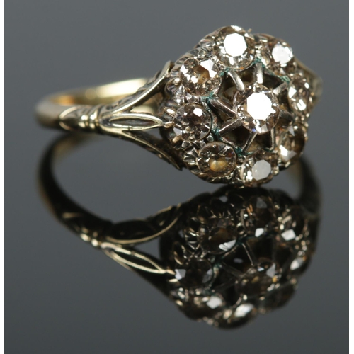 128 - An 18ct gold diamond cluster ring. Approximately 1.25ct diamond. Size P. 3.4g.