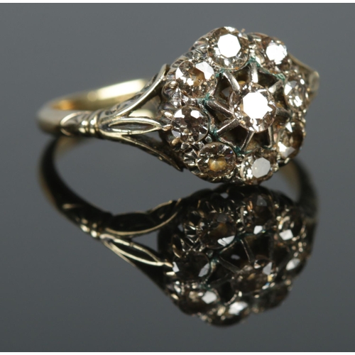 128 - An 18ct gold diamond cluster ring. Approximately 1.25ct diamond. Size P. 3.4g.