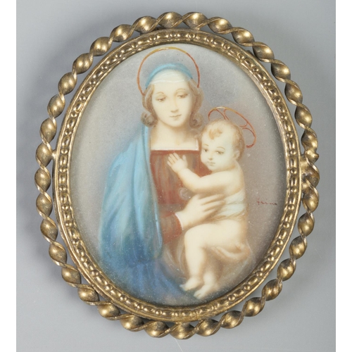 134 - Two oval gilt framed portrait miniatures, both depicting Madonna and child. 6.5cm x 5cm.