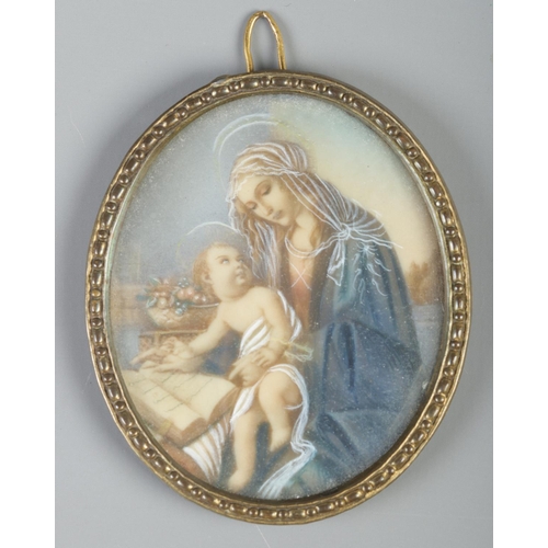 134 - Two oval gilt framed portrait miniatures, both depicting Madonna and child. 6.5cm x 5cm.