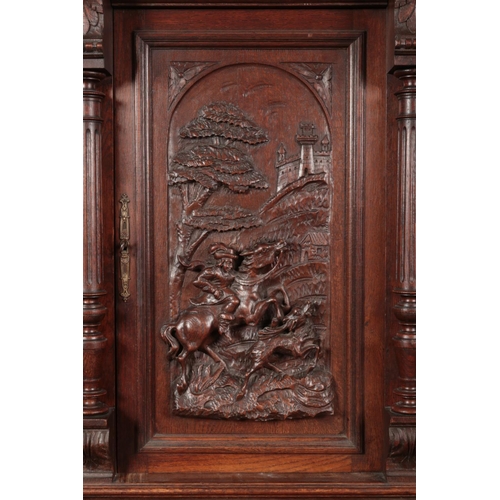 178 - A 19th century carved oak buffet deux corps. The central panel depicting a hunter on horseback. Heig... 