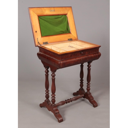 189 - A Victorian satinwood work box with turned supports, hinged lid and pull out drawer.