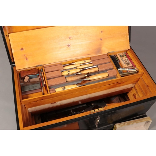 194 - A painted carpenters chest with contents of various good quality tools. Includes planes, chisels, sa... 