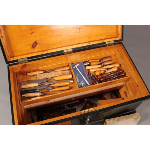 194 - A painted carpenters chest with contents of various good quality tools. Includes planes, chisels, sa... 