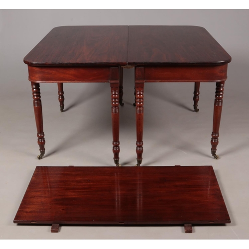 195 - A Georgian mahogany D end dining table raised on turned supports. Length extended 181cm, Width 114cm... 