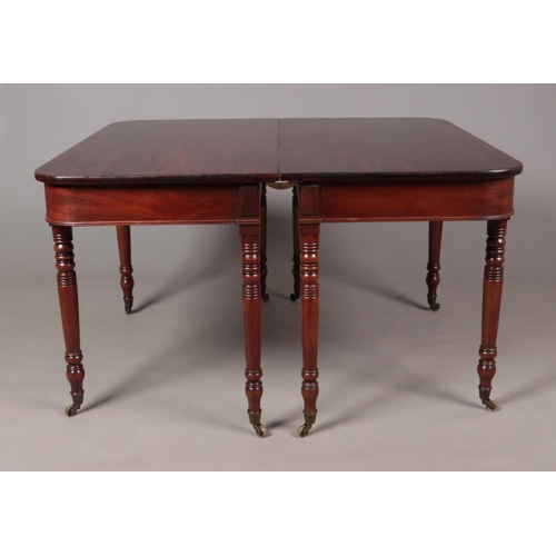 195 - A Georgian mahogany D end dining table raised on turned supports. Length extended 181cm, Width 114cm... 