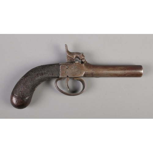 61 - A 19th century percussion cap pistol. Overall length 7.5inch.