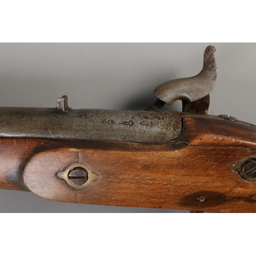 62 - A 19th century Enfield percussion cap two band carbine. Stamped to lock plate with crowned VR and 18... 