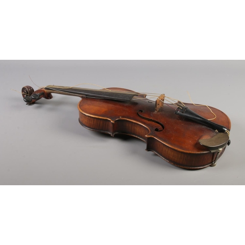 79 - A  19th century two piece back violin, labelled for Joseph Guarnerius dated 1886. In wooden case wit... 