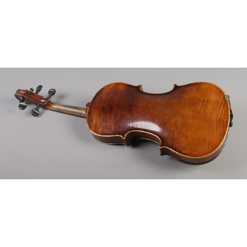 79 - A  19th century two piece back violin, labelled for Joseph Guarnerius dated 1886. In wooden case wit... 