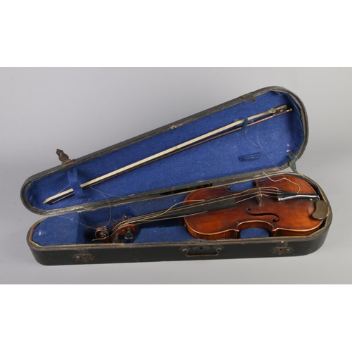 79 - A  19th century two piece back violin, labelled for Joseph Guarnerius dated 1886. In wooden case wit... 