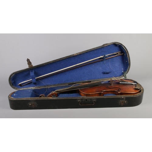 79 - A  19th century two piece back violin, labelled for Joseph Guarnerius dated 1886. In wooden case wit... 