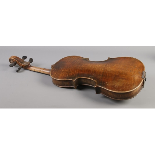 80 - An antique one piece back violin housed in inlaid walnut case. Bearing label 'Nicolaus Amatus fecit ... 