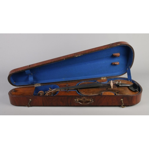 80 - An antique one piece back violin housed in inlaid walnut case. Bearing label 'Nicolaus Amatus fecit ... 