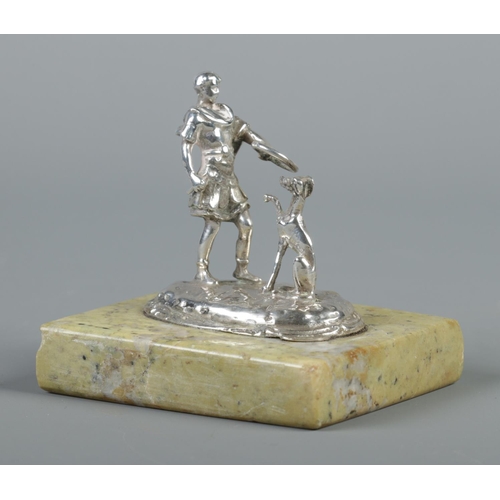 94 - An Edwardian silver model of a Roman training a dog, on polished stone plinth. Assayed London 1902. ... 