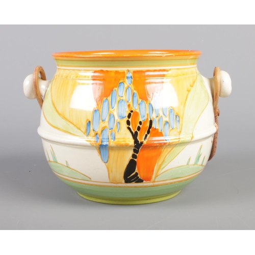 1 - A Clarice Cliff Bizarre Fantasque biscuit barrel decorated in the Windbells design. Shape No. 335.