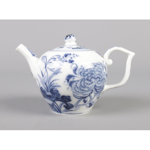 14 - An 18th century Meissen miniature teapot decorated in underglaze blue. Height 8.5cm.