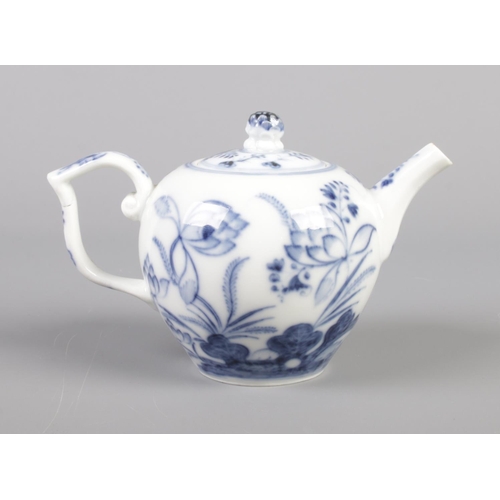 14 - An 18th century Meissen miniature teapot decorated in underglaze blue. Height 8.5cm.