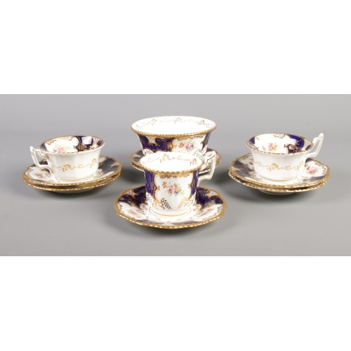 15 - A collection of late 19th/early 20th century Coalport Batwing china teawares in the 2665 pattern. El... 