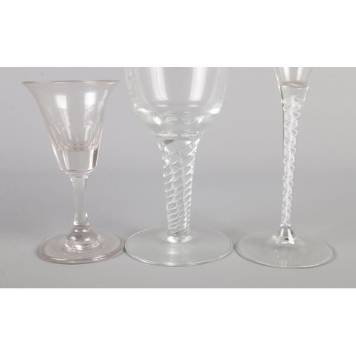 21 - Two 18th century drinking glasses, along with a later air twist champagne flute.