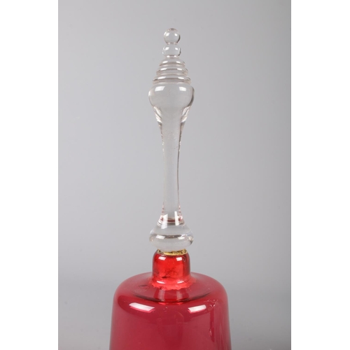 22 - Three Victorian glass bells. Includes marble swirl example and two cranberry coloured examples.